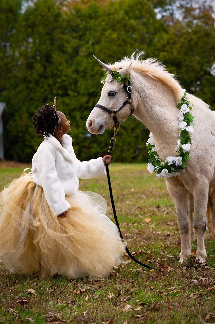 Photo of unicorn look at child